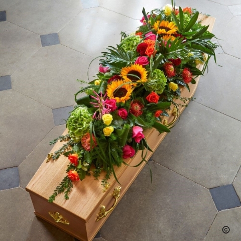 Vibrant exotic casket spray